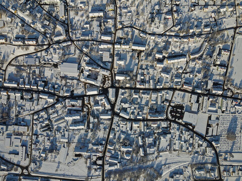aerial shot of the snow covered village Fohnsdorf in Austria