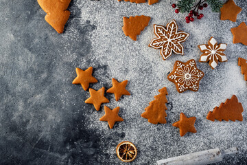 Collection of various gingerbread cookies in a box with fir branches