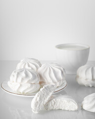sweet marshmallows and a mug of milk