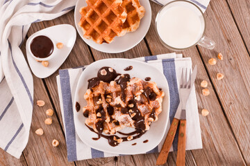 Waffles with chocolate cream and hazelnuts.