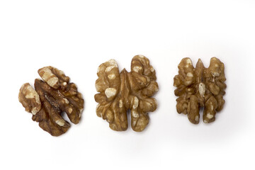 ripe walnut halves standing isolated white background