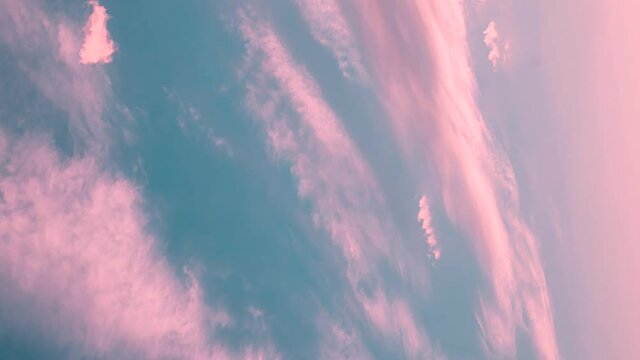 Vertical Shot Light Blue And Pink Cirrus Clouds Cloud Sky. natural cloudscape vertical background. 4K Time Lapse, Timelapse, Time-lapse