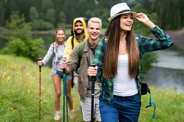 Group of happy hiker friends trekking as part of healthy lifestyle outdoors activity