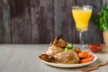 Whole roasted chicken with vegetables. Close up