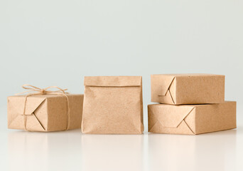 paper bag and boxes on light gray background