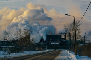 The road to the factory with smoking chimneys. Ecological concept.