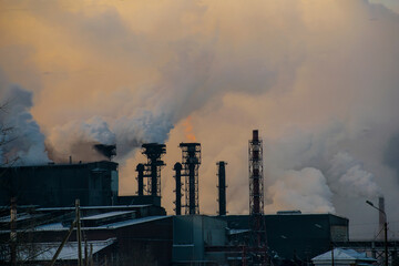 Fuming chimneys of industrial infrastructure. Ecological concept.