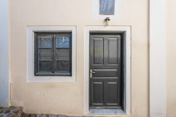Retro style wooden door and wall backgrounds of traditional Greek Island buildings