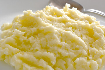 Mashed potatoes on a white plate. 