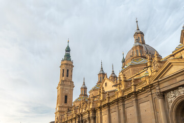 Fototapeta na wymiar Torres de la Basilica from Plaza del Pilar in the city of Zaragoza at sunset, Aragon. Spain