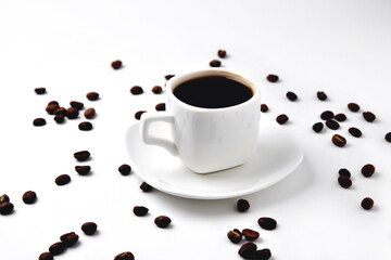white cup of coffee on a white saucer on a white background isolate, close-up, top view, coffee beans lie