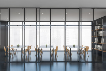Dark meeting room interior with furniture and windows with city view