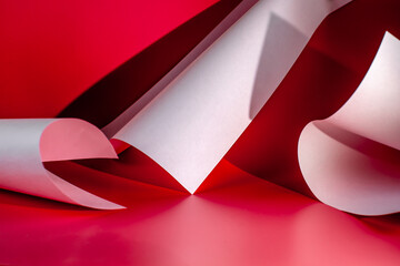Abstract curved sheets on a red background