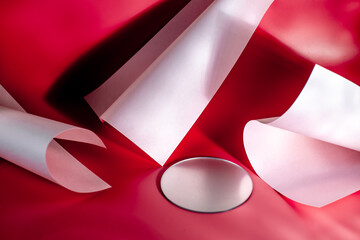 Round and curved objects on a red background