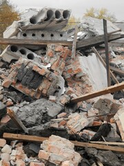 Ruins of a brick building. Old bricks, planks, destroyed concrete. - 474503291