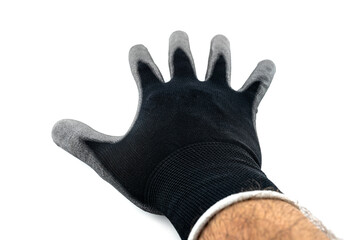 Black work glove on a mans open palm covered with latex on the inside, isolated on a white background, upper palm visible.