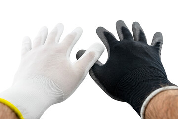 White and black working gloves on male open hands covered with latex on the inside, isolated on a white background with clipping path, crossed two thumbs.