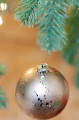 silver Christmas ball on a light abstract background