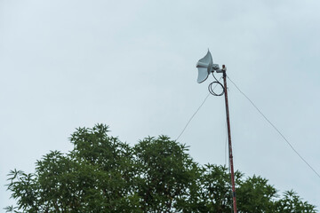 A fixed wireless internet antenna mounted on the roof of a house. Wireless broadband service at a rural area. Overcast weather. - obrazy, fototapety, plakaty