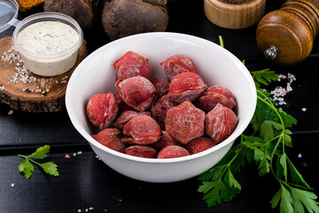 Tasty beetroot ravioli stuffed with baked beets and meat. Colored dumplings