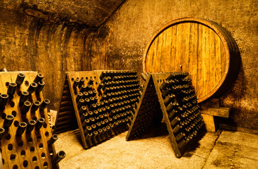 Old sparkling wine cellar for traditional method, Constant temperature arched cellar with French barrique oak barrels to age wine at Klet Brda.