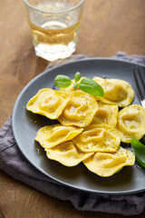 Boiled ravioli with fresh basil