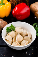boiled ravioli with parsley. Traditional pelmeni, ravioli,