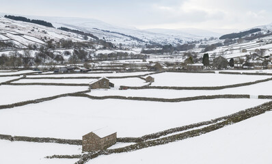 North Yorkshire dales covered in snow in winter showing field patterns