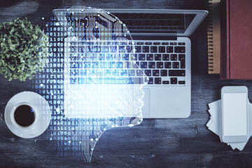Double exposure of brain drawing hologram over topview work table background with computer. Concept of big data.