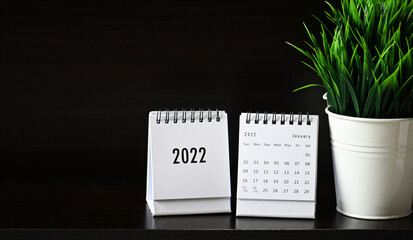 Happy new year 2022. Close up calendar on business desk background