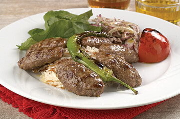 hearty meatballs served in a small bowl.