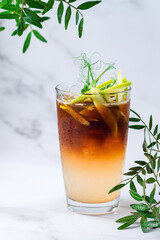 Cocktail with cola, apples and whiskey