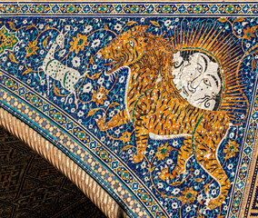 Uzbekistan, Samarkand, at the famous Registan Square. Details from the tiger mosaics at the facade of Sher-Dor Madrasah. 