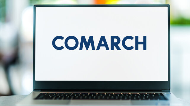 Laptop computer displaying logo of Comarch