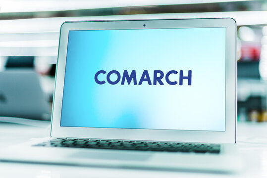 Laptop computer displaying logo of Comarch