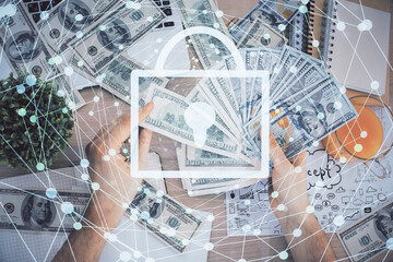 Double exposure of lock drawing hologram and us dollars bills and man hands. Security concept