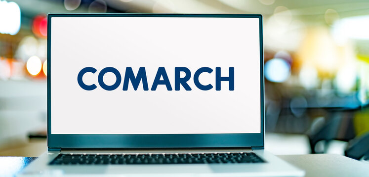 Laptop computer displaying logo of Comarch