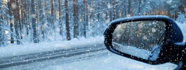 car rearview mirror in winter, winter travel concept