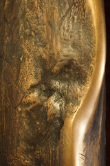 Texture of uneven metal with a wave, bronze close-up - 474521080