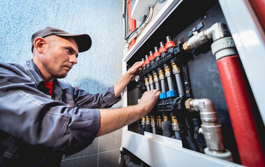 HVAC technician servicing home heating and cooling system