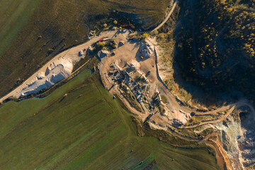 Aerial view of mining quarry, crushing machinery for crushed stone and gravel