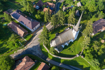Aerial drone point of view of a whitewashed protestant church © salajean