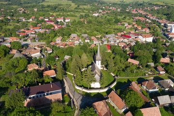 Aerial drone point of view of a whitewashed protestant church © salajean