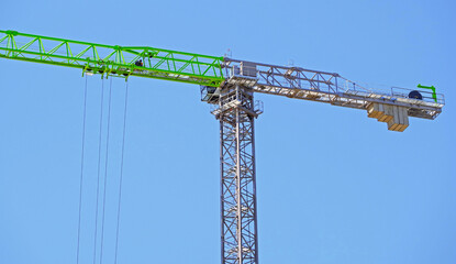 Naklejka premium construction crane at sky background