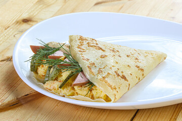 Pancake with potato and sausages