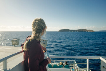 girl looks at the island Molokini Crater near maui island, hawaii © IBRESTER