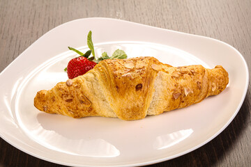 Sweet croissant in the plate