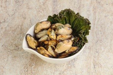 Tasty marinated mussels in the bowl