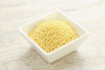 Raw couscous in the bowl