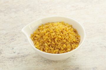 Raw bulgur in the bowl